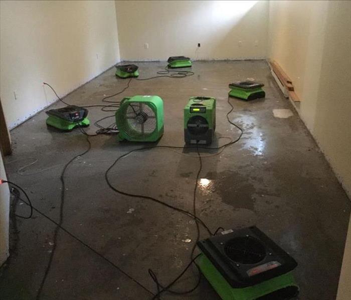 Concrete Basement Floor with Drying Equipment set up